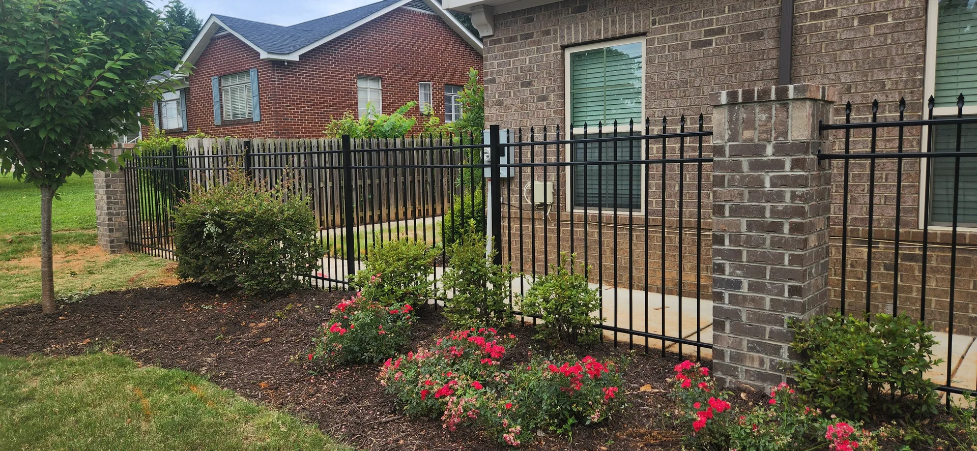 Black aluminum picket fence brick column rose bed mulch gastonia nc