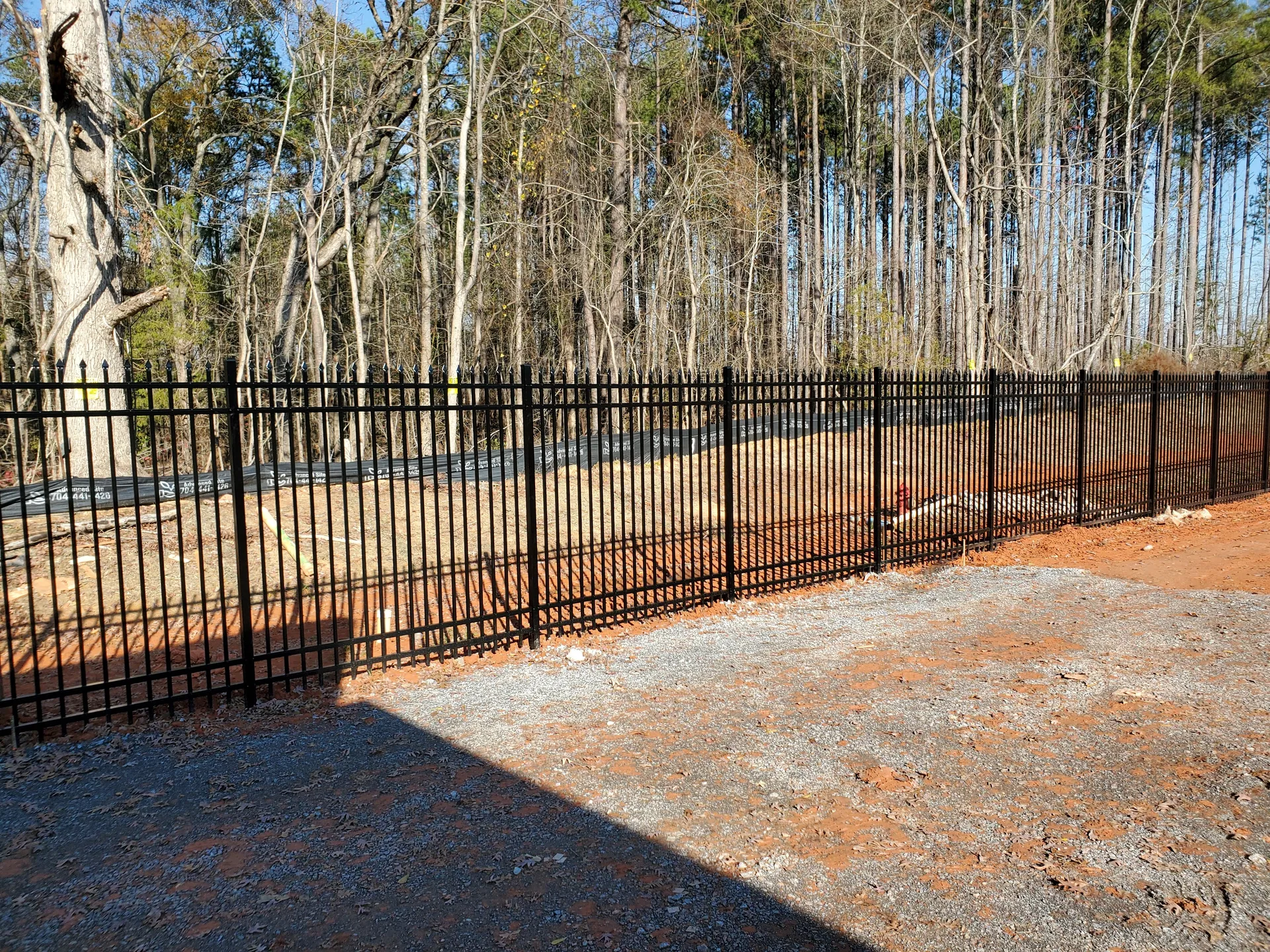 Black aluminum picket fence gravel lot gastonia nc