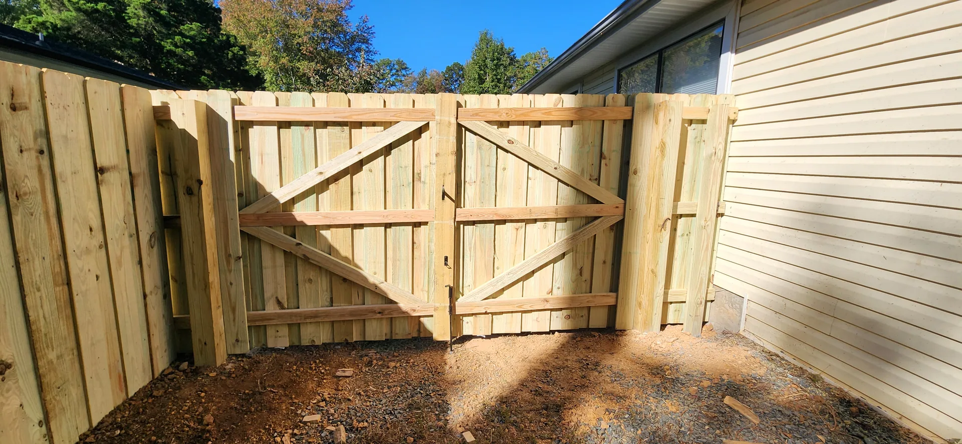Double swing wood gate z brace side yard beige house stanley nc