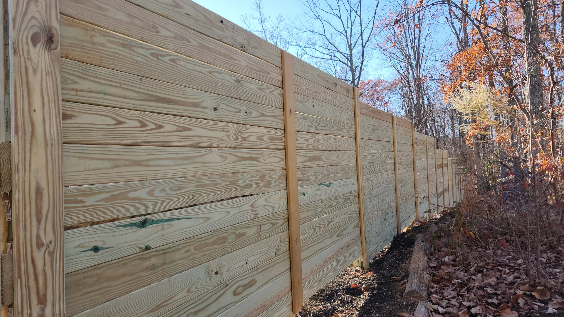 Horizontal board pressure treated fence vertical battens fall woods lowell nc