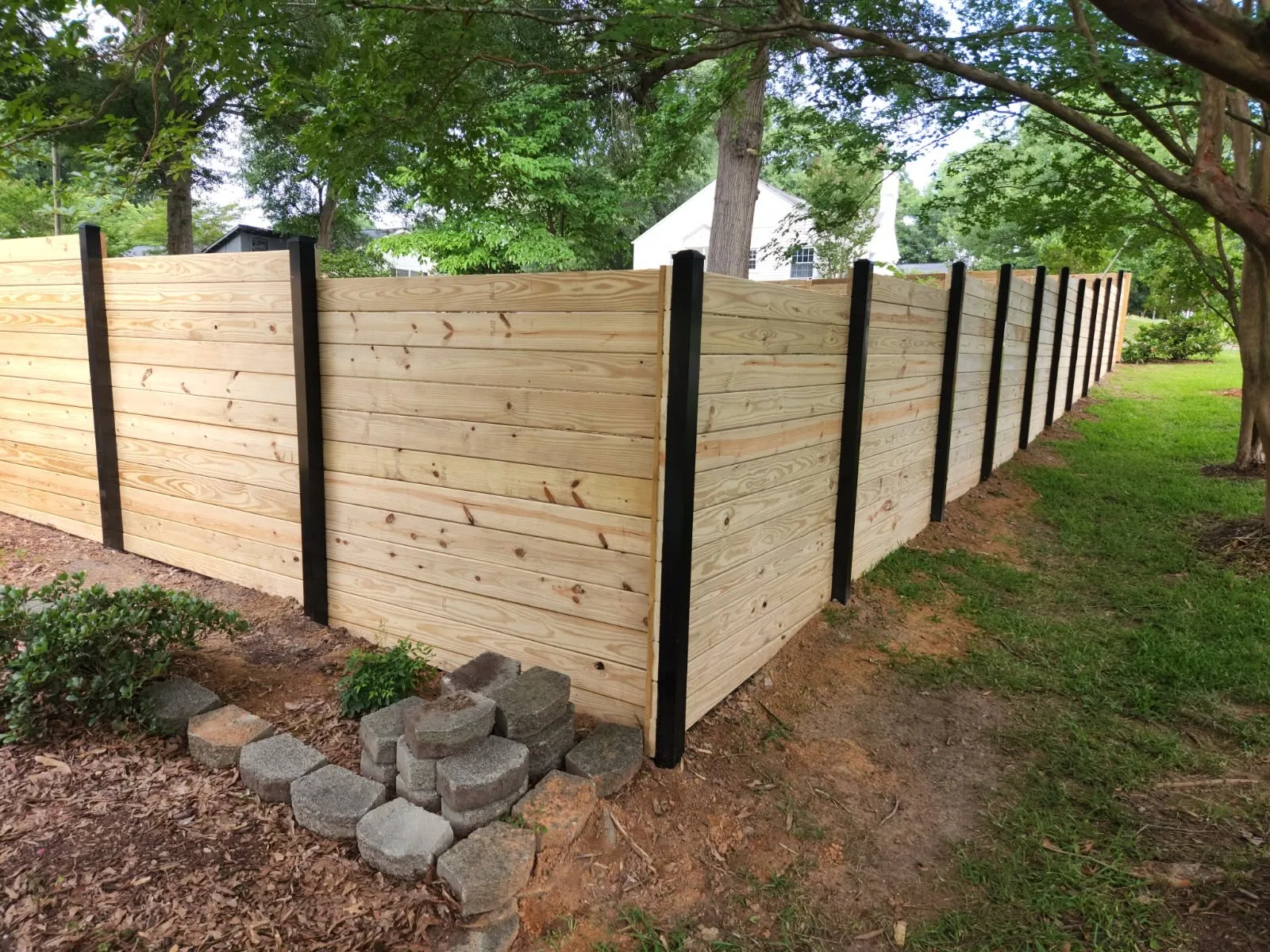 Horizontal board privacy fence black steel posts corner retaining blocks mcadenv