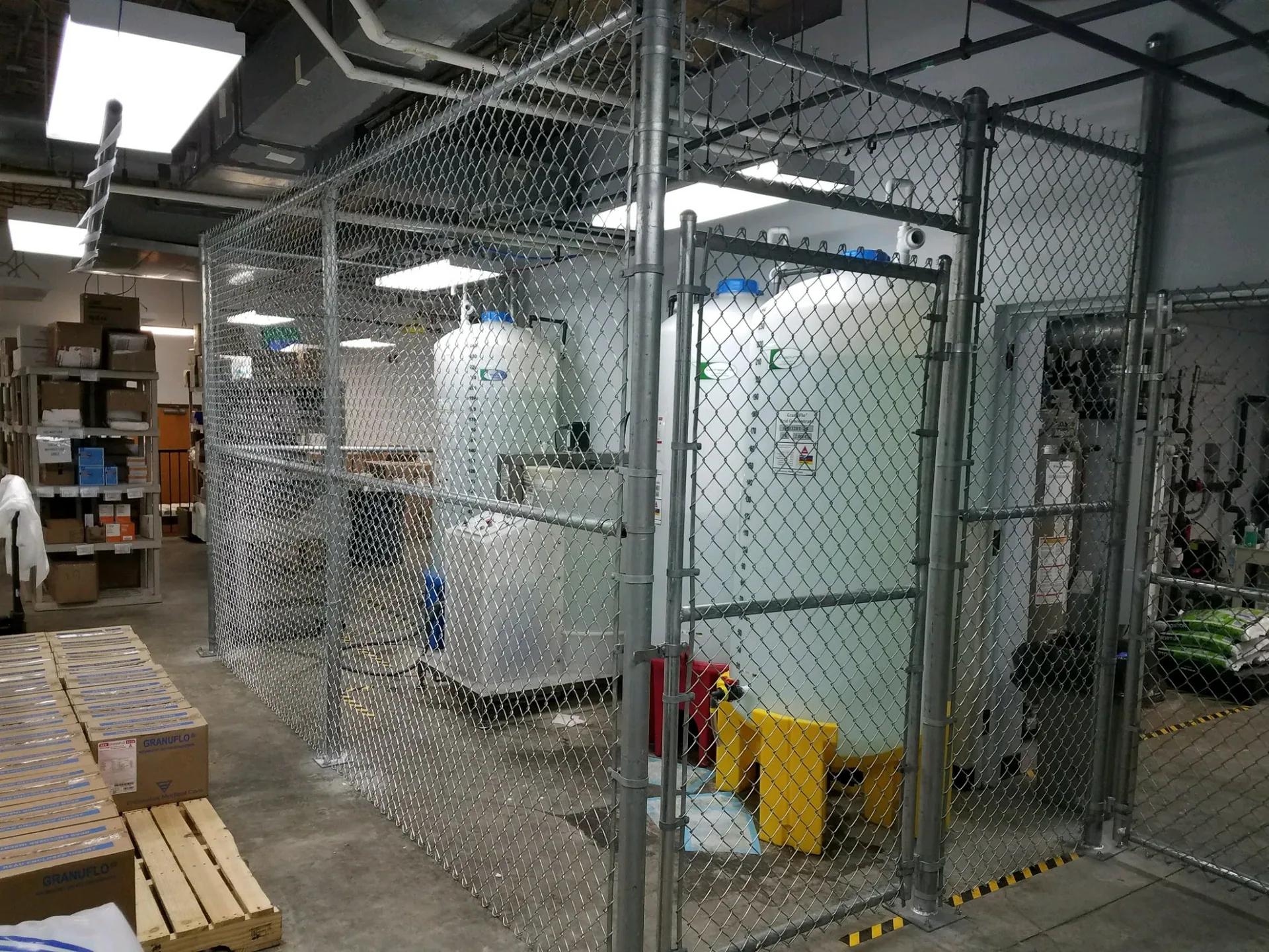 Indoor chain link enclosure storage tanks gastonia