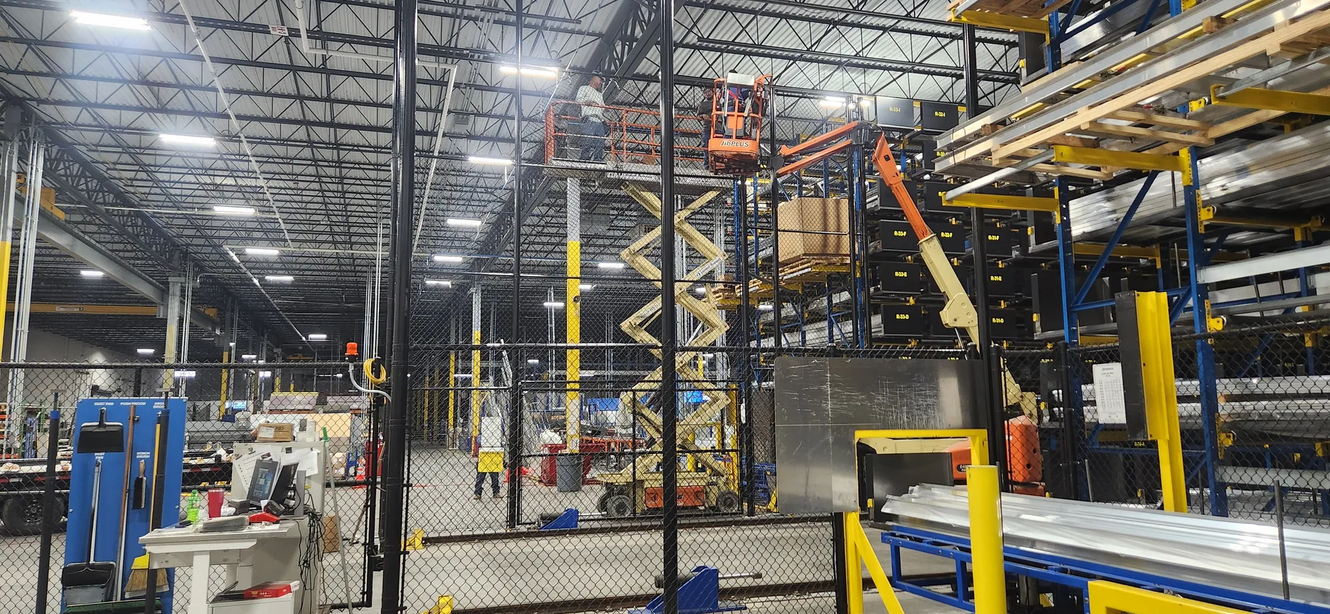 Interior warehouse black chain link partition scissor lift pallet racking gaston