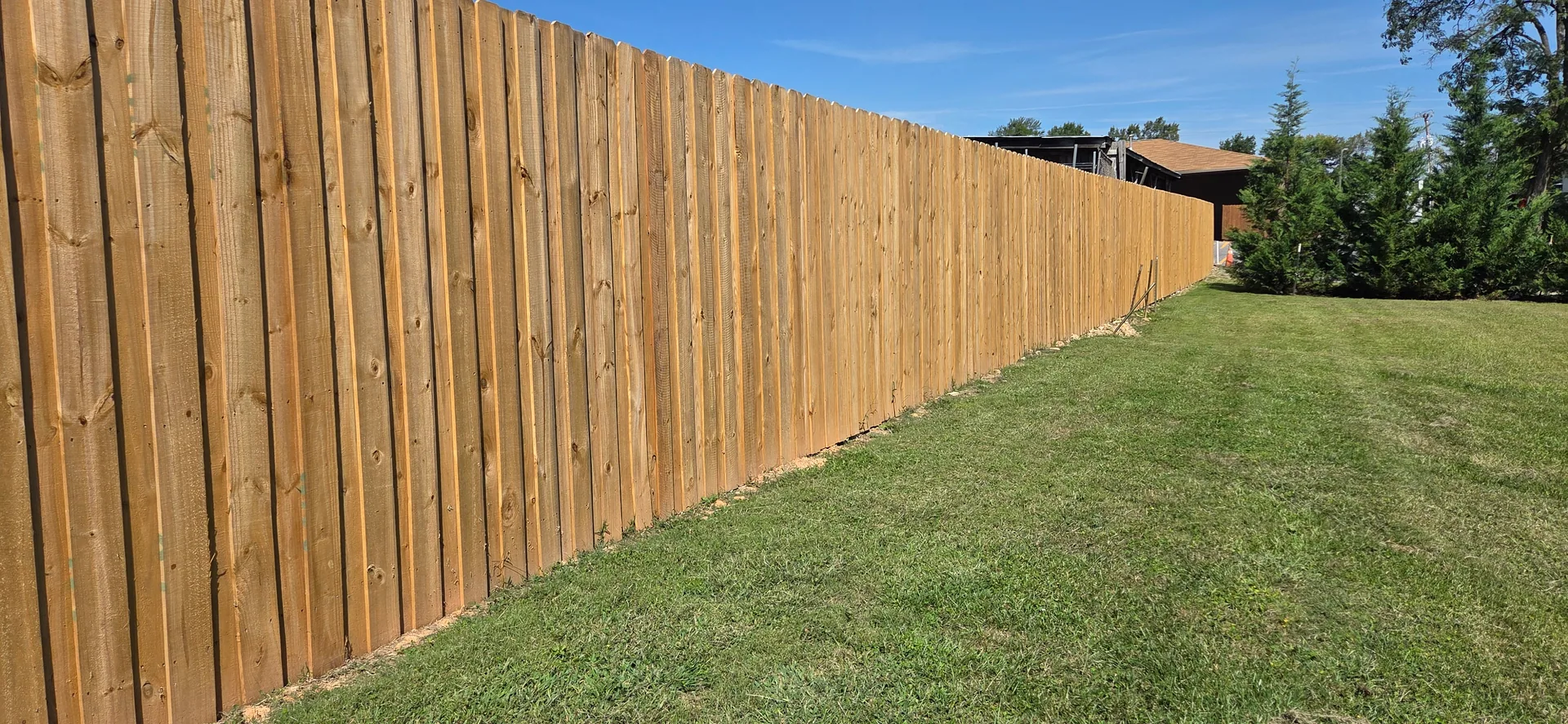 A finished J & G wood privacy fence