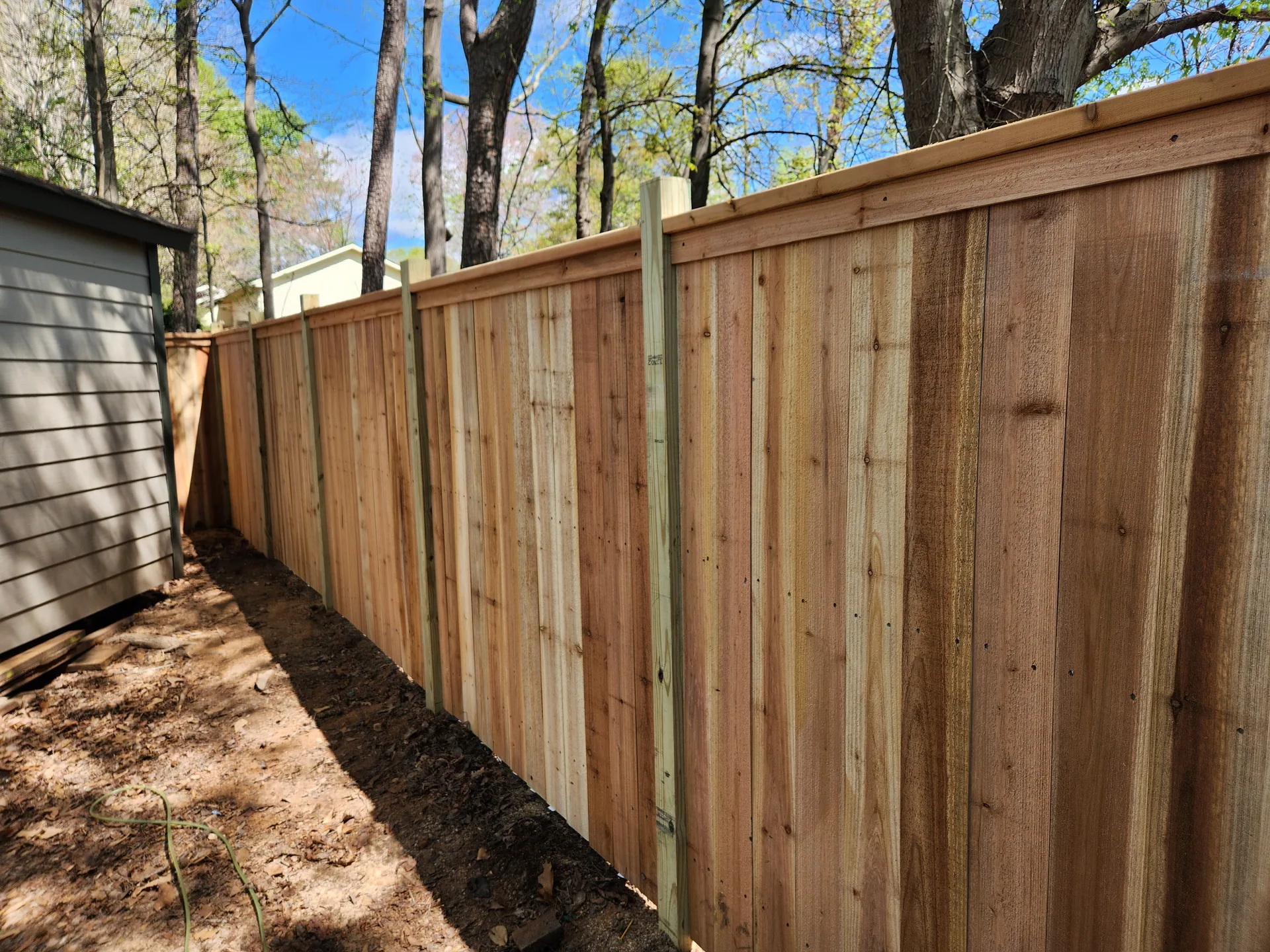 New cedar board privacy fence cap rail side yard mcadenville nc