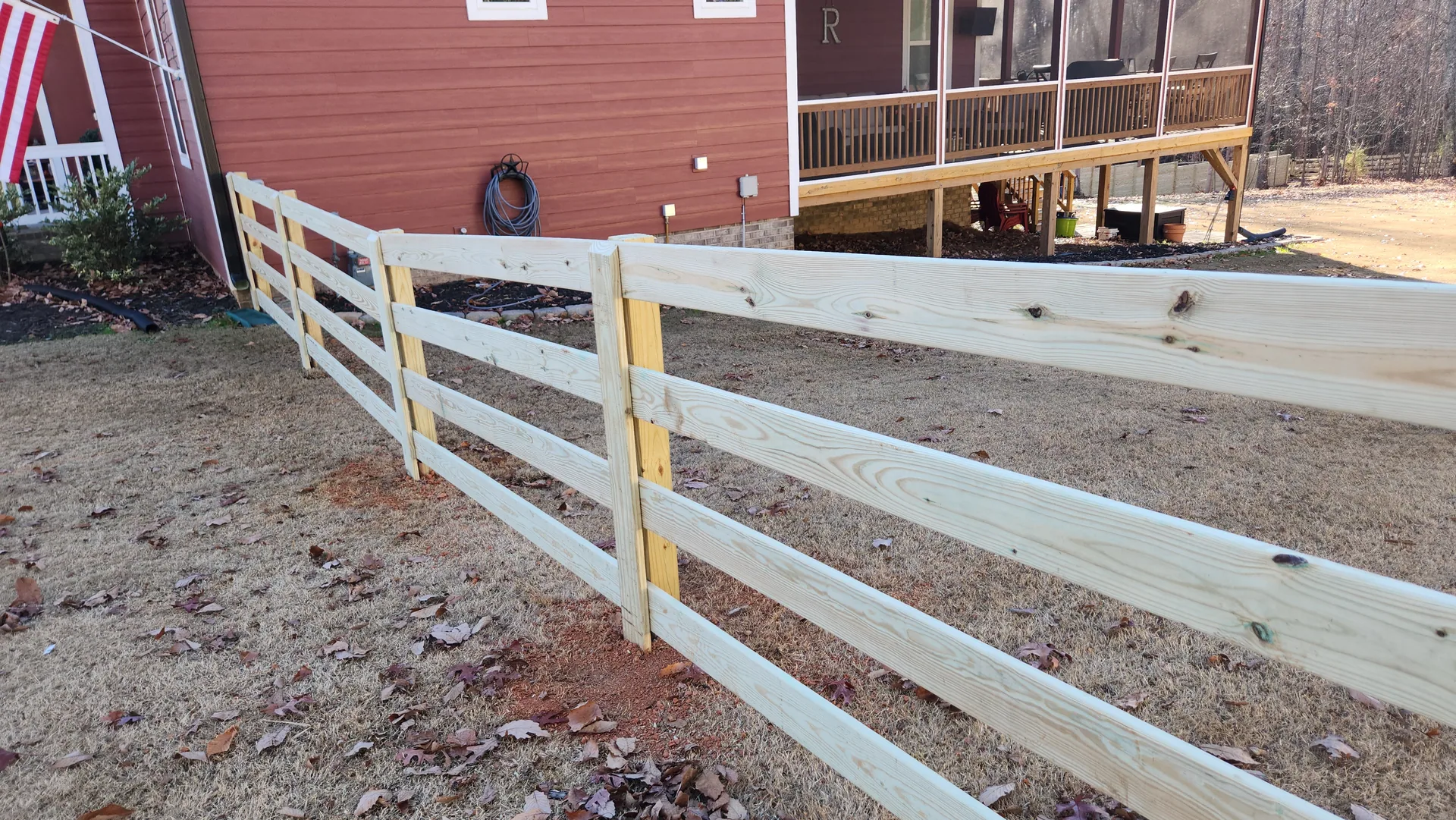 New four rail pressure treated board fence dormant lawn red house dallas nc