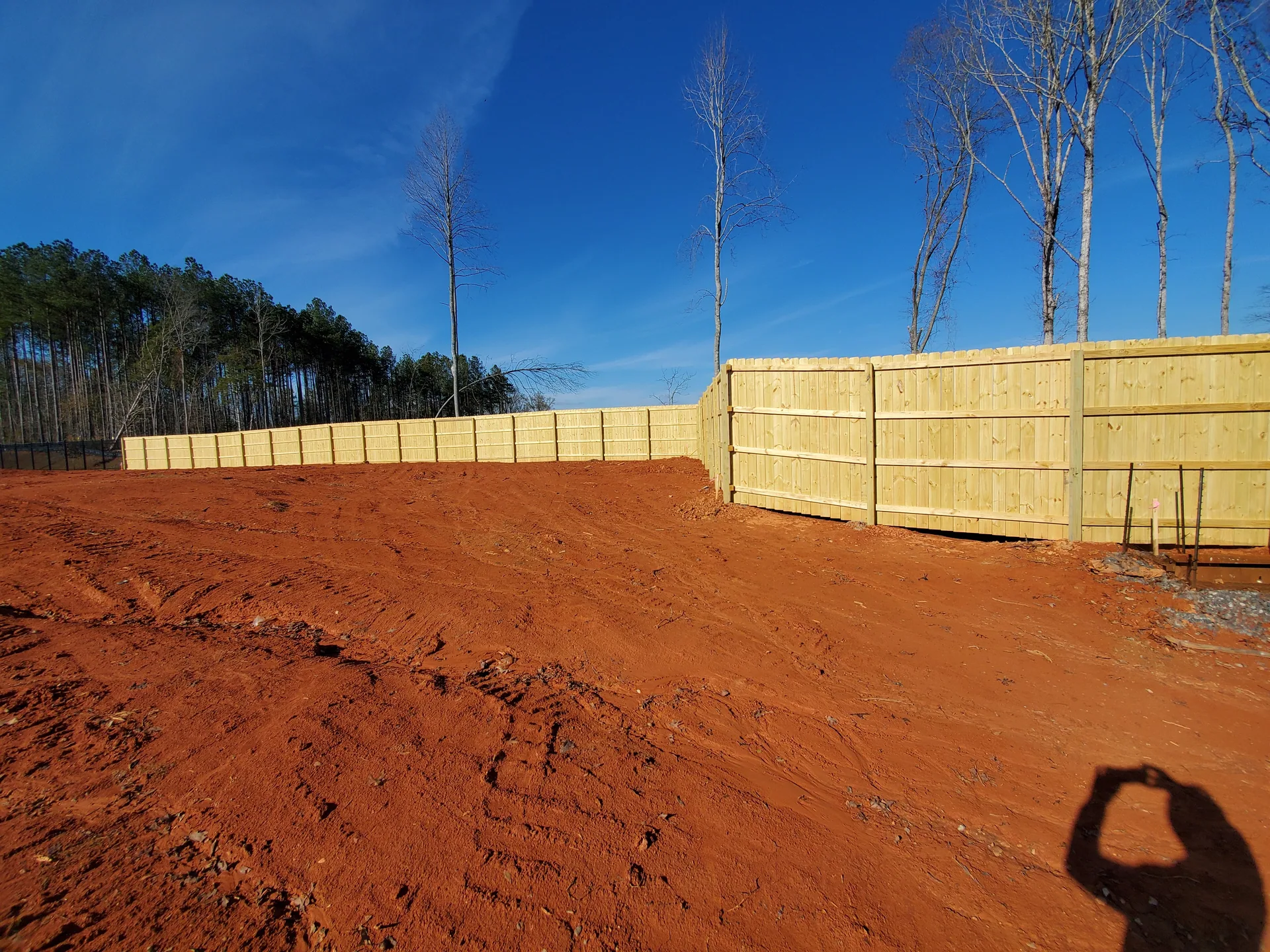 New wood privacy fence red clay graded lot gastonia