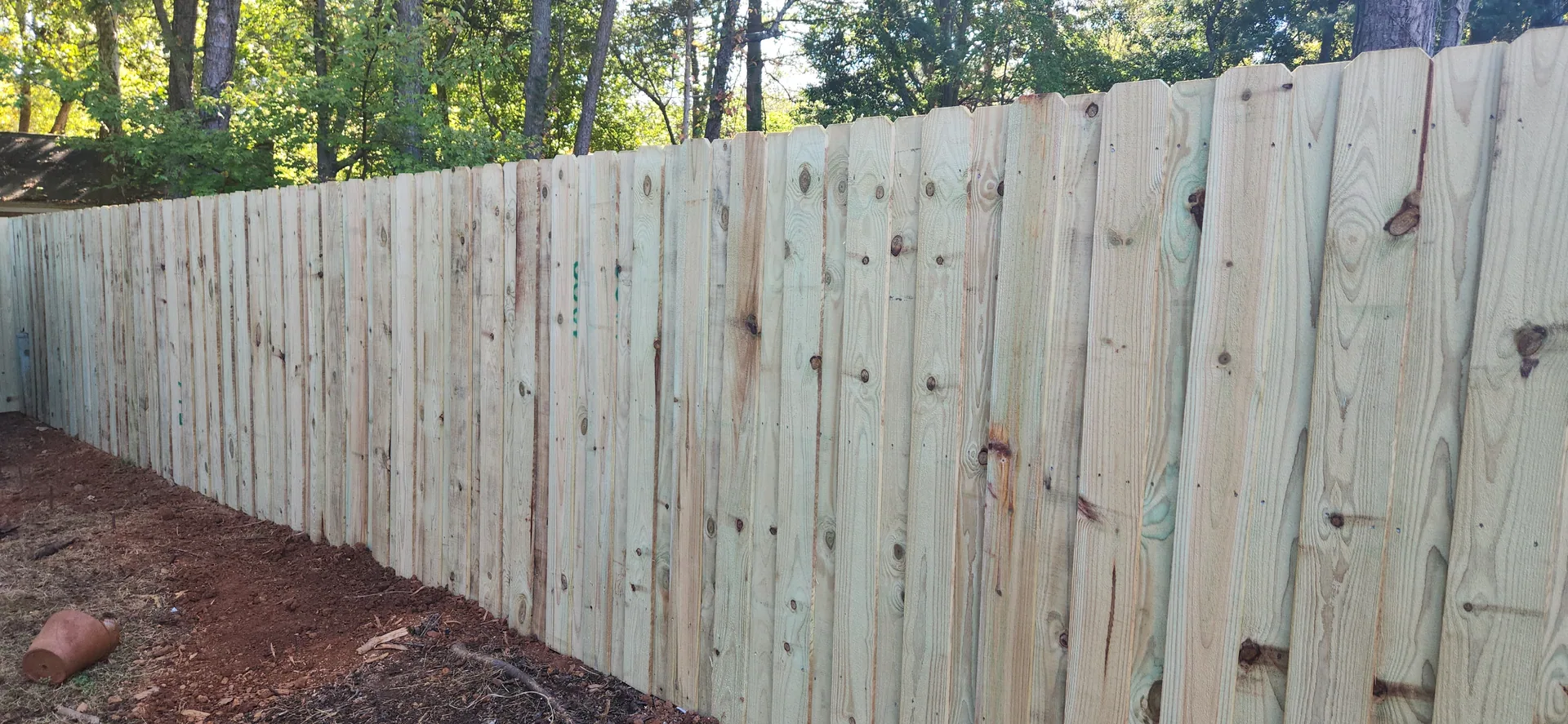 Pressure treated pine board fence red clay yard trees belmont nc