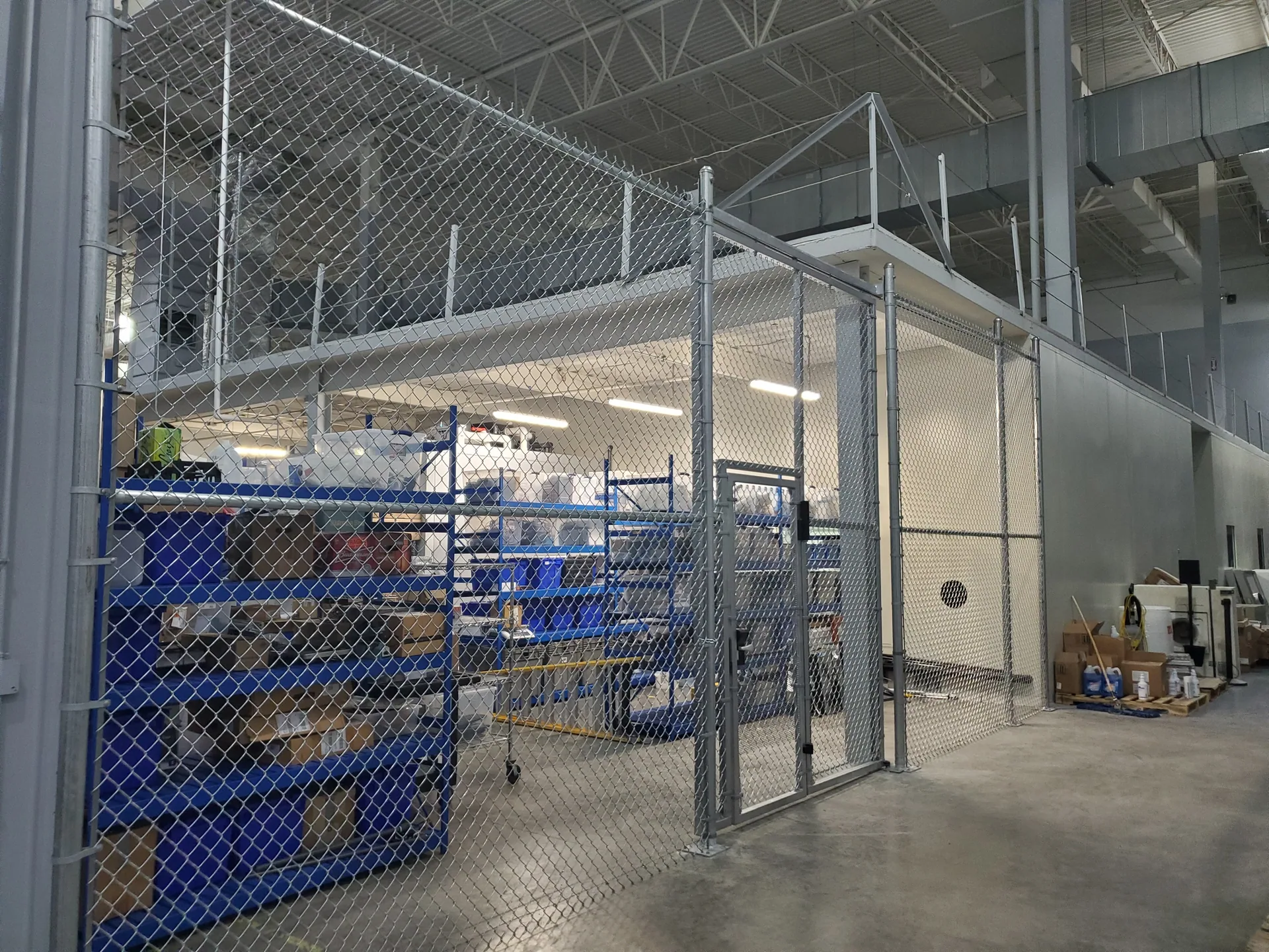 Warehouse security cage chain link blue shelving gaston county